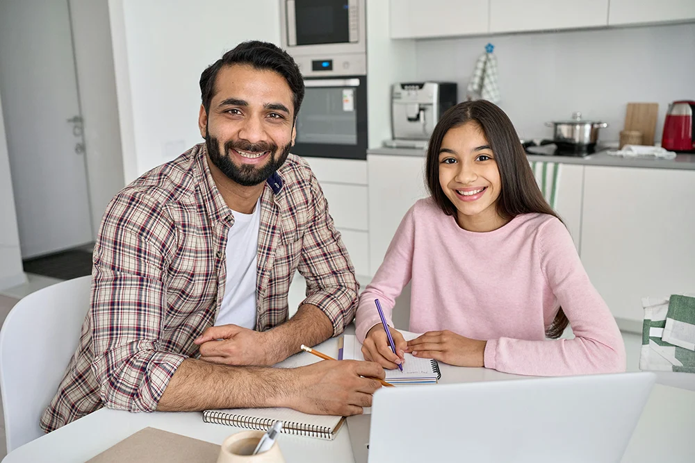 Father offering emotional support to his teen daughter while coping with life changes and transitions