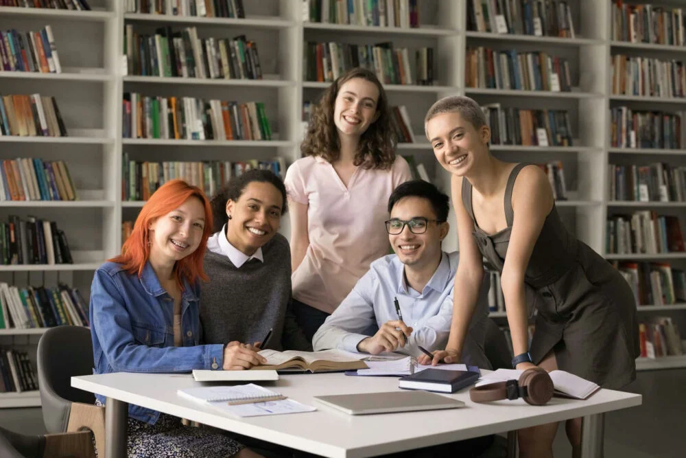 teens gather in a library to discuss a back-to-school checklist