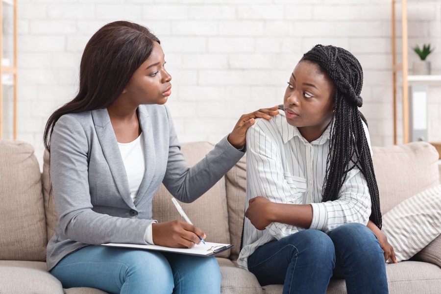 a-teen-girl-being-comforted-by-therapist-in-therapy